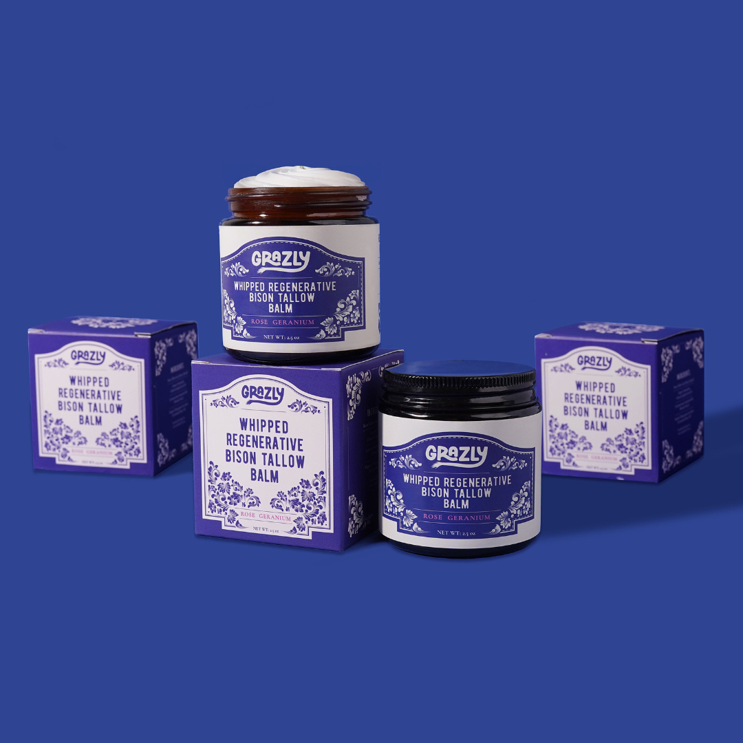 'Assorted natural balm products, coconut, and honeycomb displayed against a white background.'